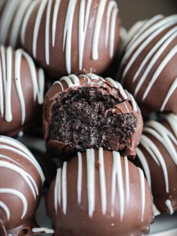 Close up of Oreo Truffles, one missing a bite.