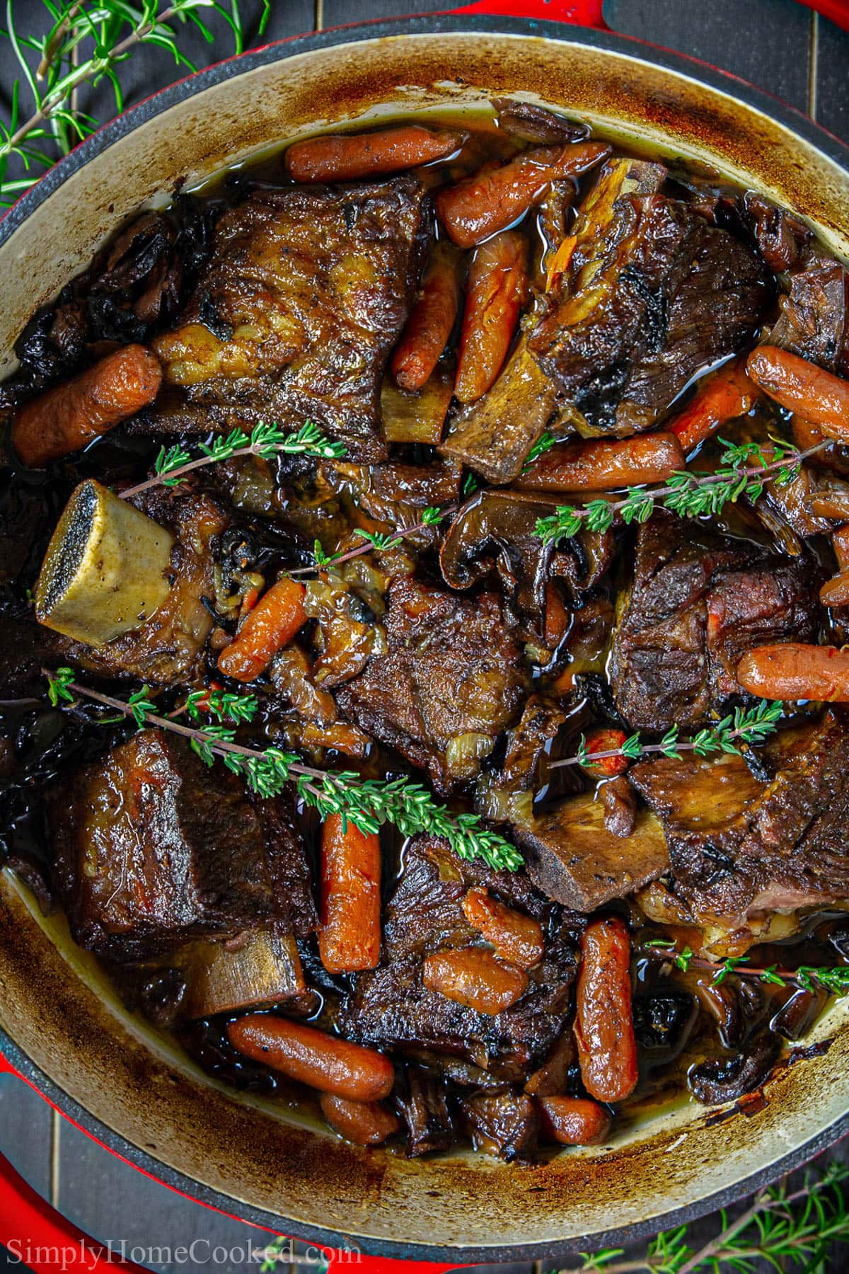 Vertical overhead image of Braised Beef Short Ribs in a crock pot