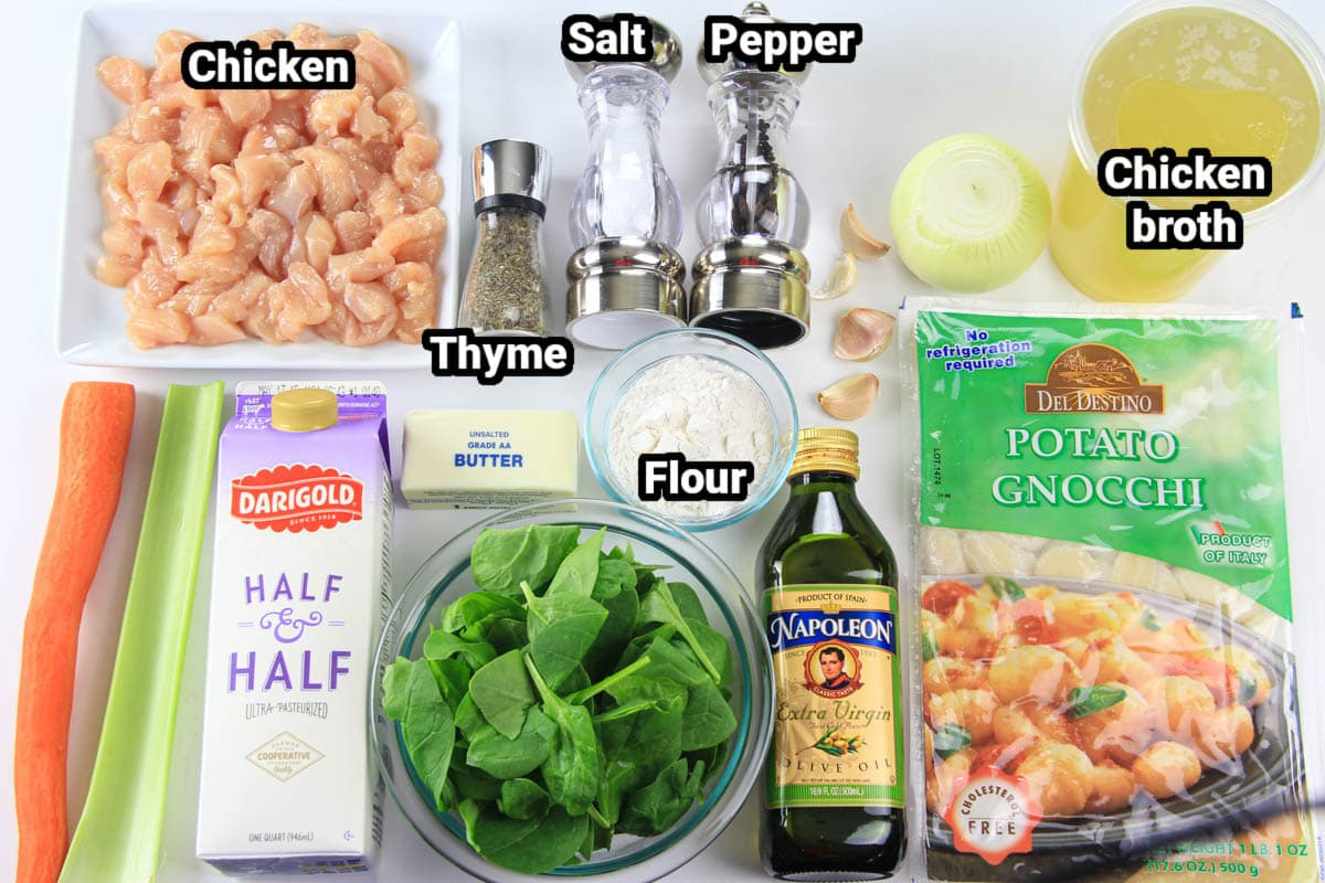 Ingredients for Chicken Gnocchi Soup, including chicken, celery, carrot, thyme, butter, half & half, spinach, salt, pepper, flour, oil, garlic, onion, chicken broth, and potato gnocchi