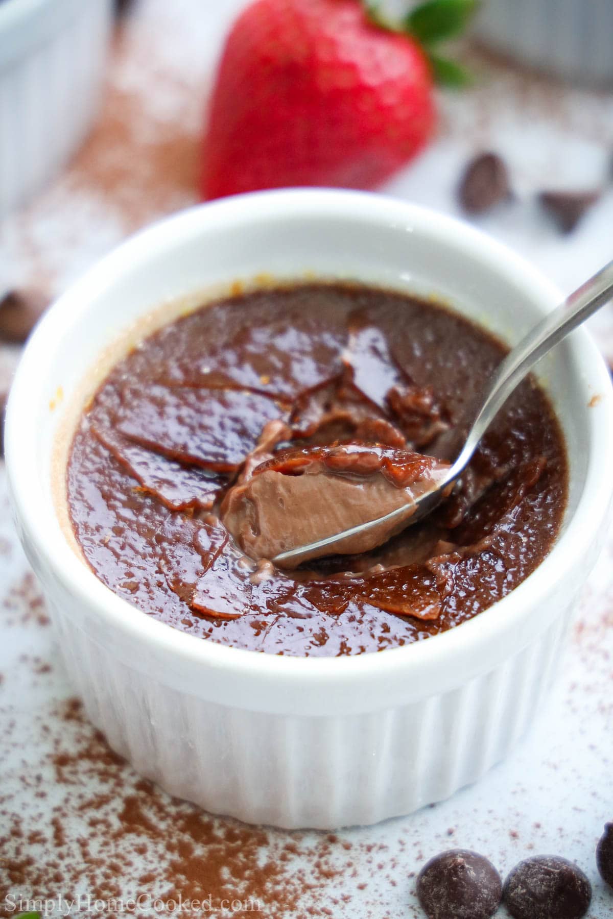 Chocolate Creme Brulee with a spoonful being lifted out