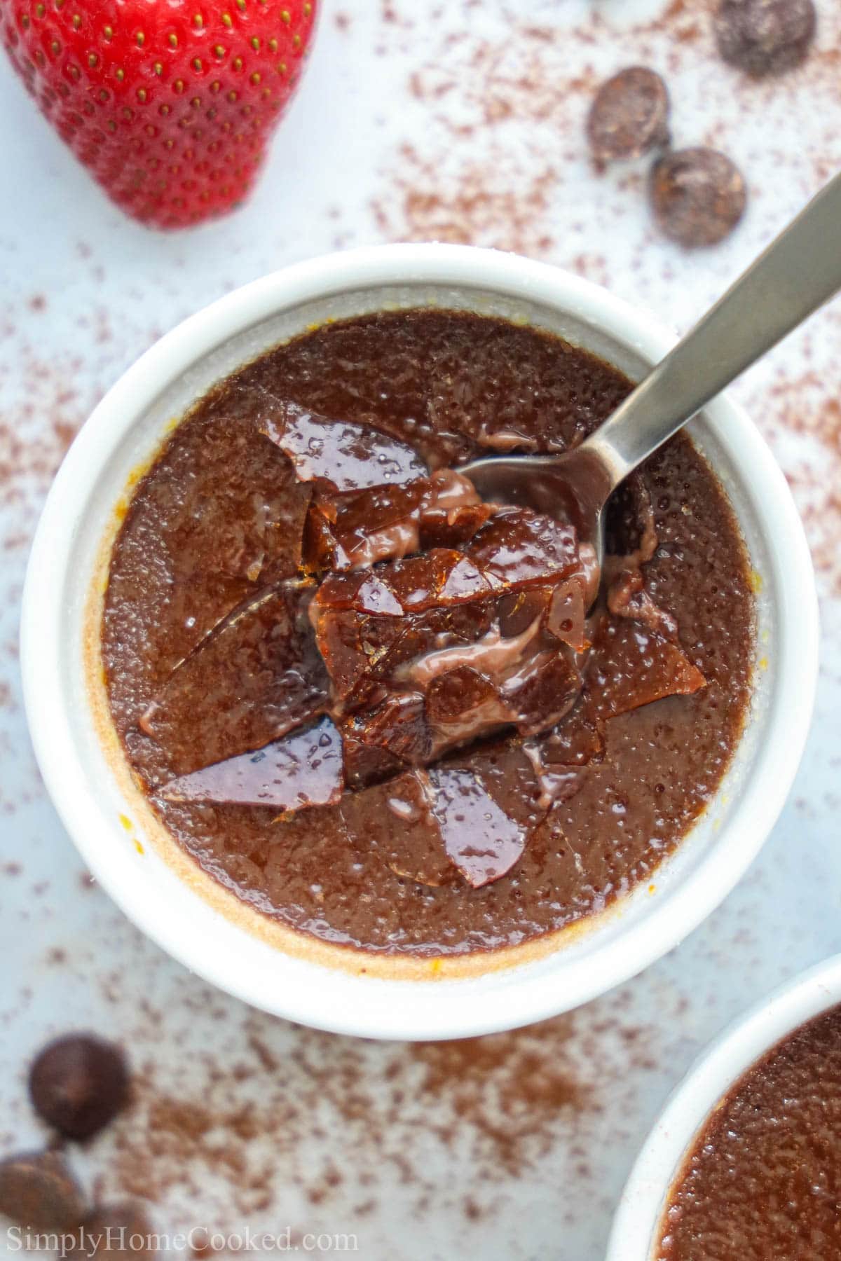Chocolate Creme Brulee with a spoon dipped into it
