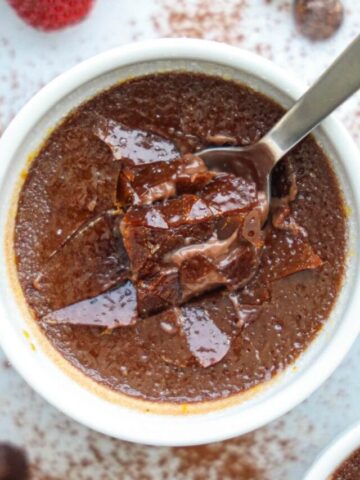 Chocolate Creme Brulee with a spoon dipped into it