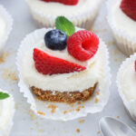 Close up of No Bake Mini Cheesecakes topped with fresh berries