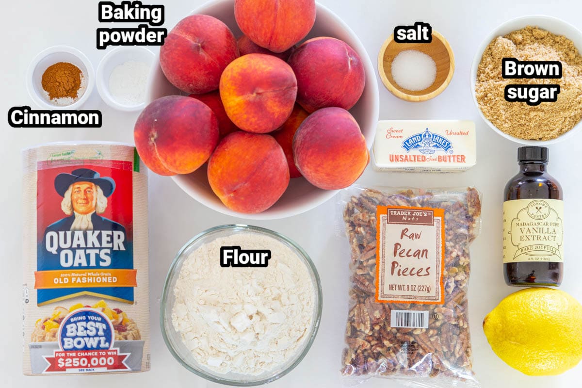 Ingredients for Peach Crisp, including peaches, oats, baking powder, cinnamon, salt, brown sugar, butter, lemon juice, flour, pecans, and vanilla.