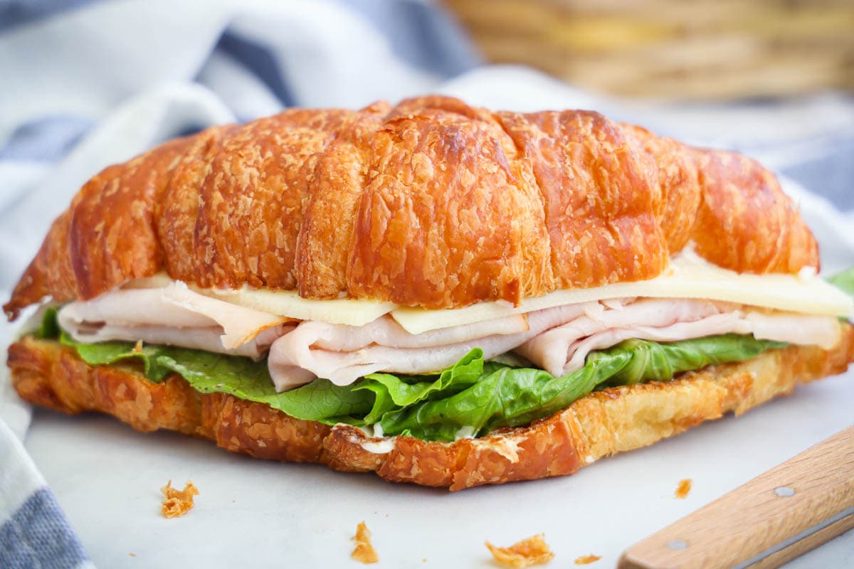 Turkey Croissant Sandwich on a cutting board