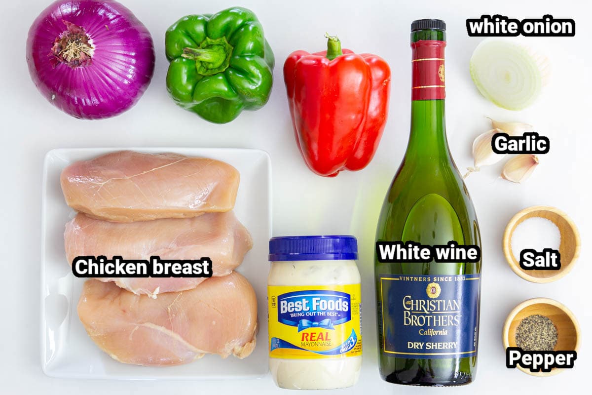Ingredients for chicken kabobs: red onion, green and red peppers, white wine, chicken breasts, mayonnaise, salt, pepper, onion and garlic cloves.