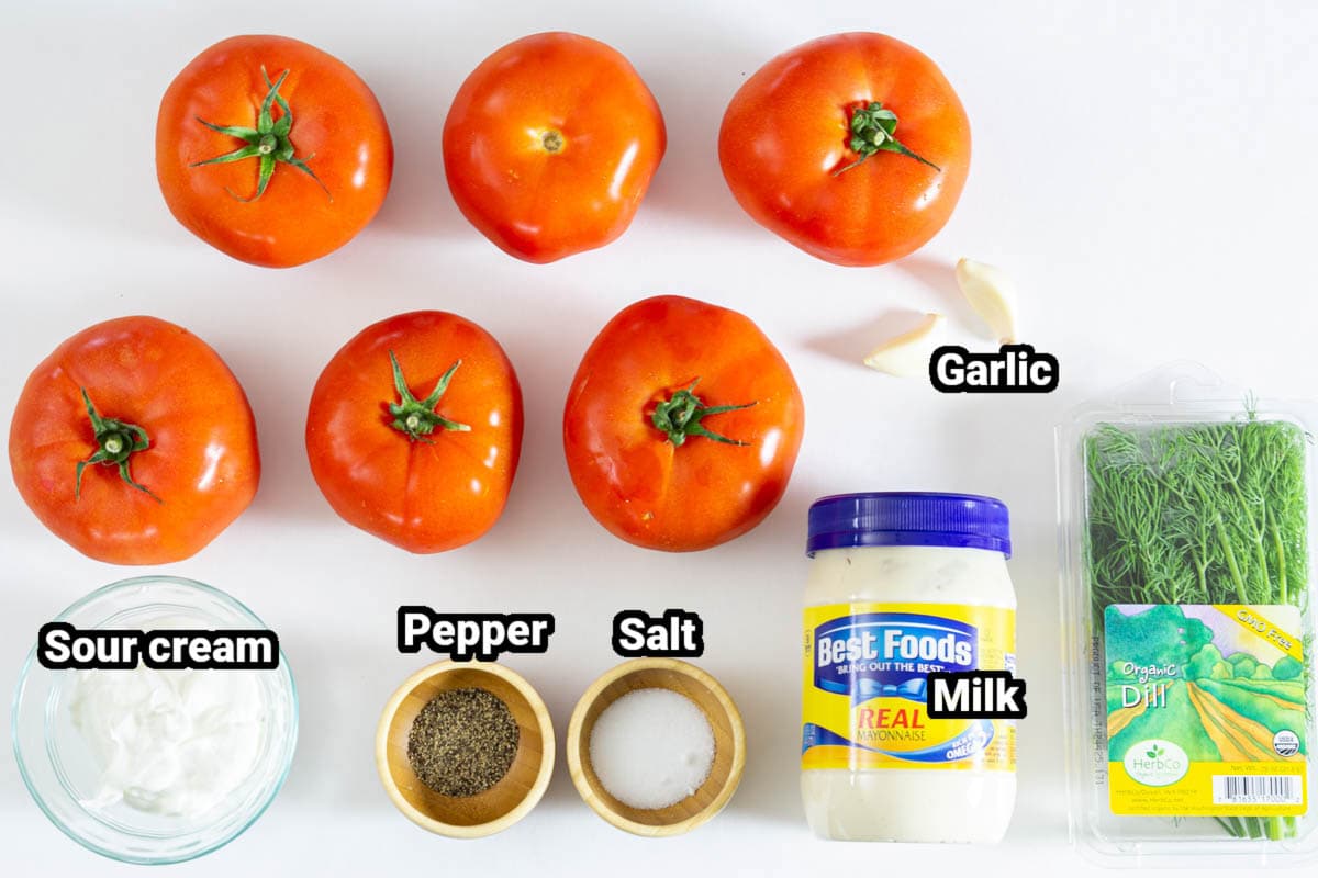 Ingredients for Tomato Garlic Salad: tomatoes, mayo, sour cream, garlic, fresh dill, salt, and pepper.