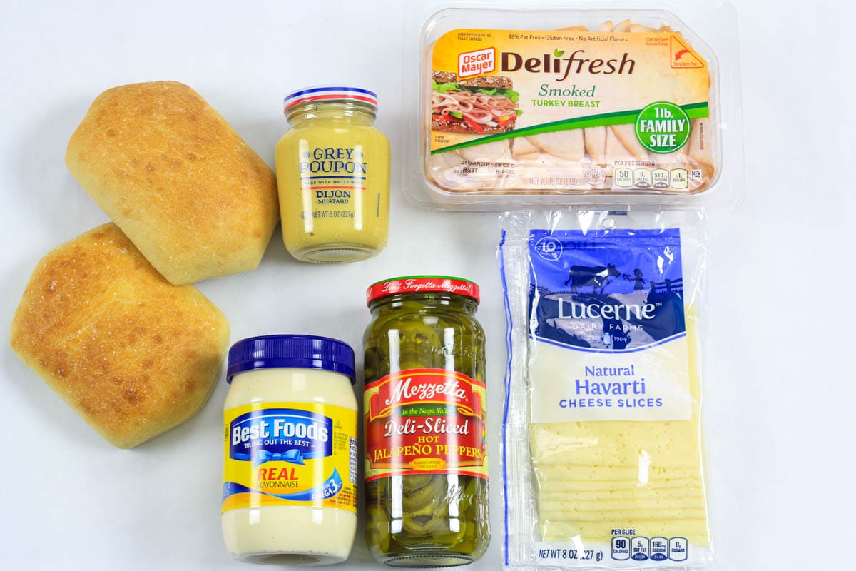 Ingredients for Turkey Panini: mayo, Dijon mustard, smoked turkey, ciabatta, Havarti cheese, and jalapenos.