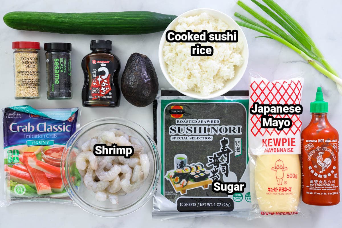Ingredients for Volcano Roll: Sushi rice, shrimp, imitation crab, cucumber, avocado, unagi sauce, green onions, black and white sesame seeds, sushi nori, Japanese mayo, and Sriracha.