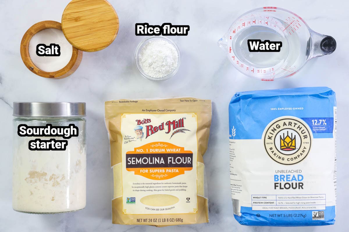 Ingredients for Sourdough Bread: Sourdough starter, salt, rice flour, water, bread flour, and semolina flour.