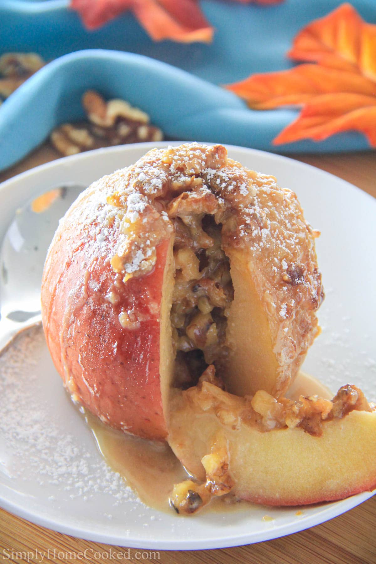 Baked Apple with a slice cut out on a white plate