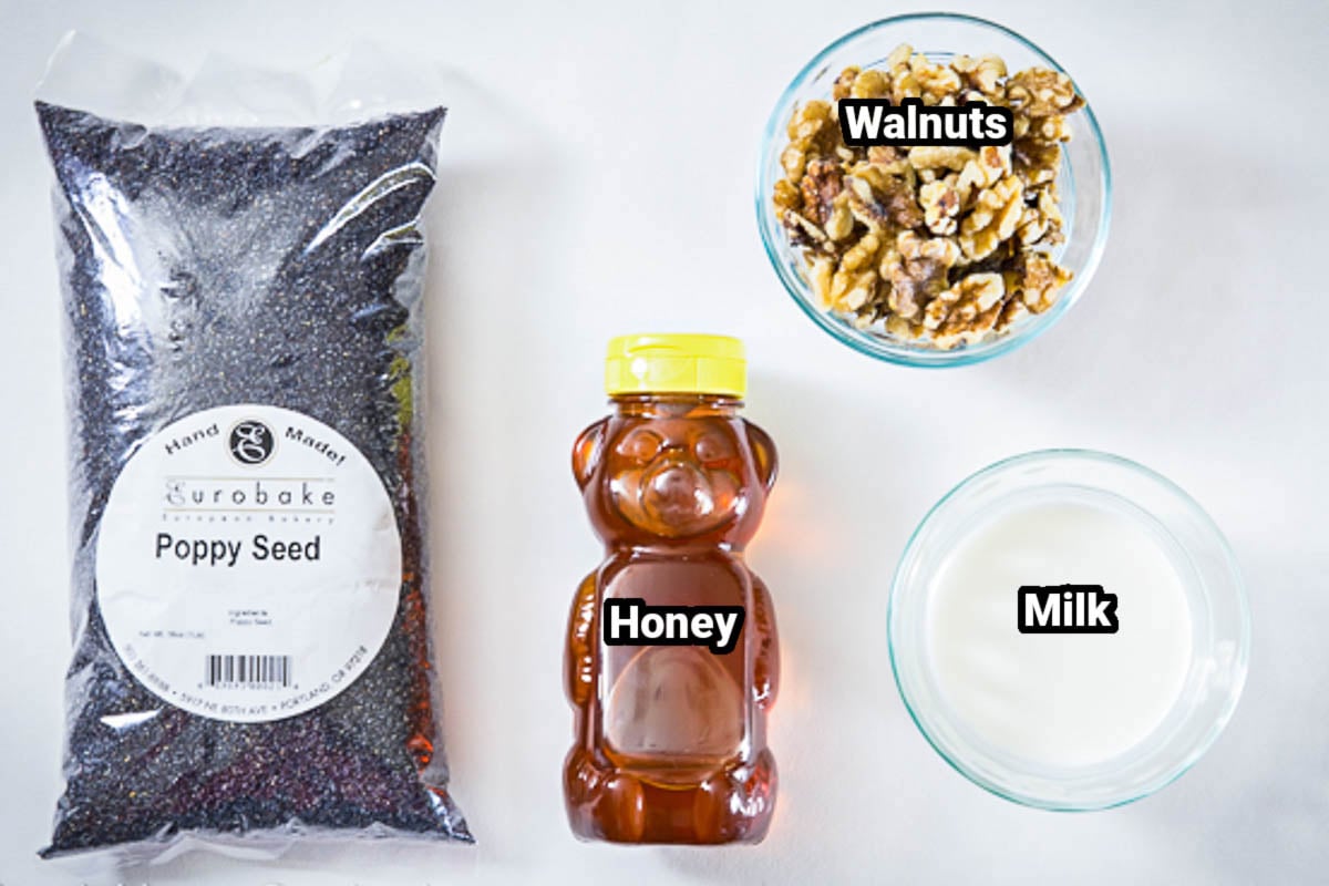 overhead image of ingredients for poppy seed filling on a white background.