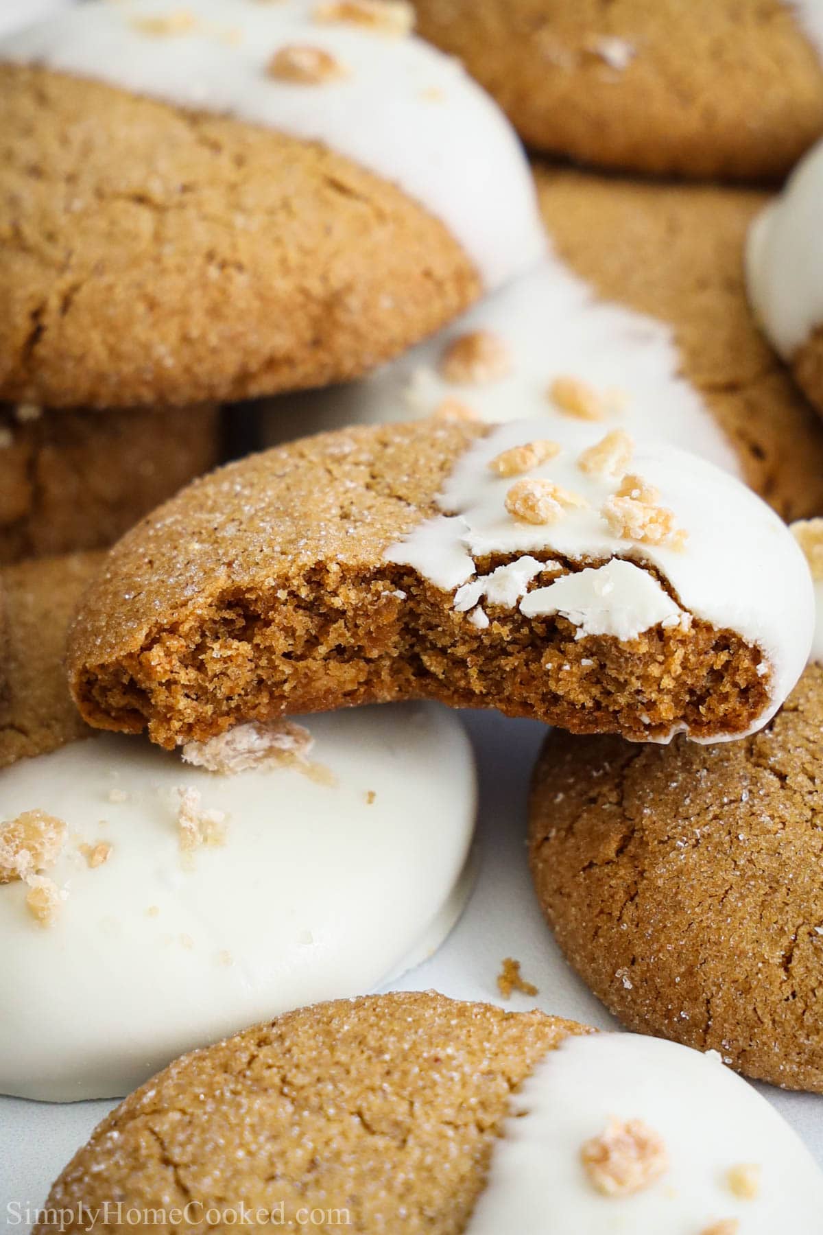 Close up of a pile of Gingersnap Cookies, one missing a bite