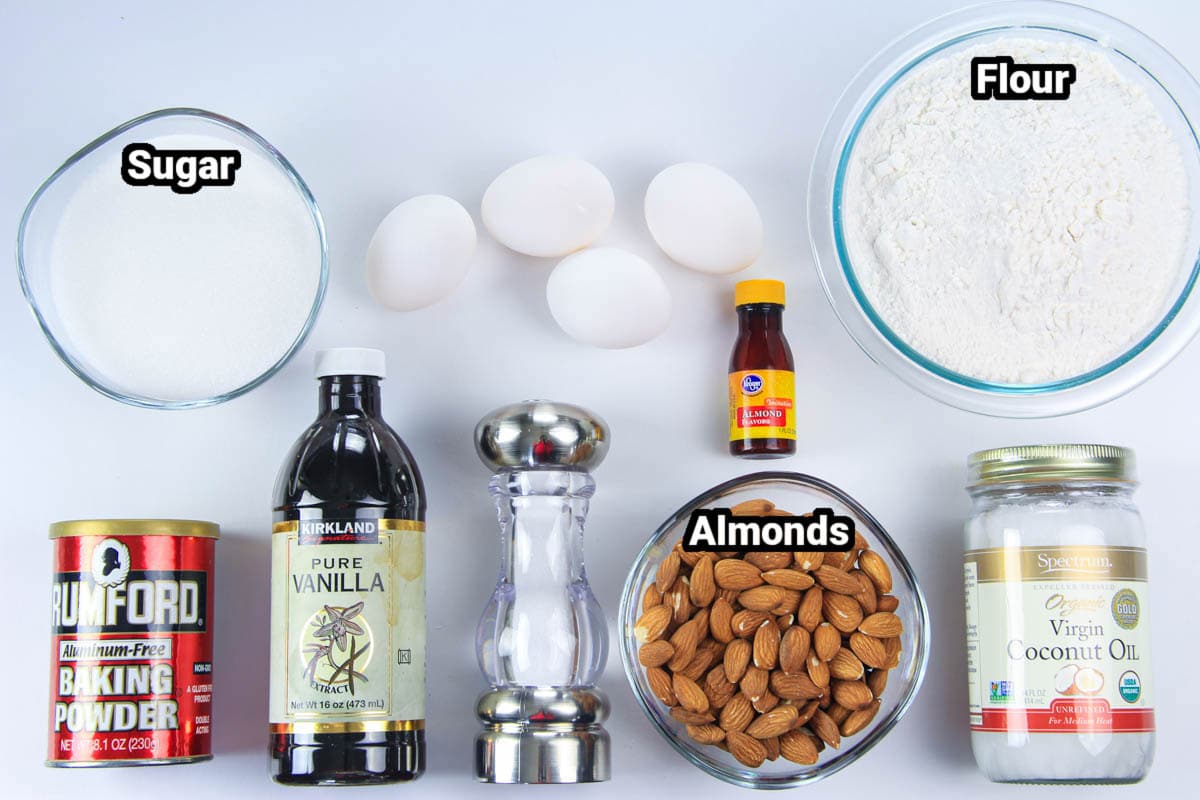 Ingredients for Chocolate Dipped Almond Biscotti: flour, sugar, eggs, almonds, coconut oil, salt, vanilla, almond extract, and baking powder.