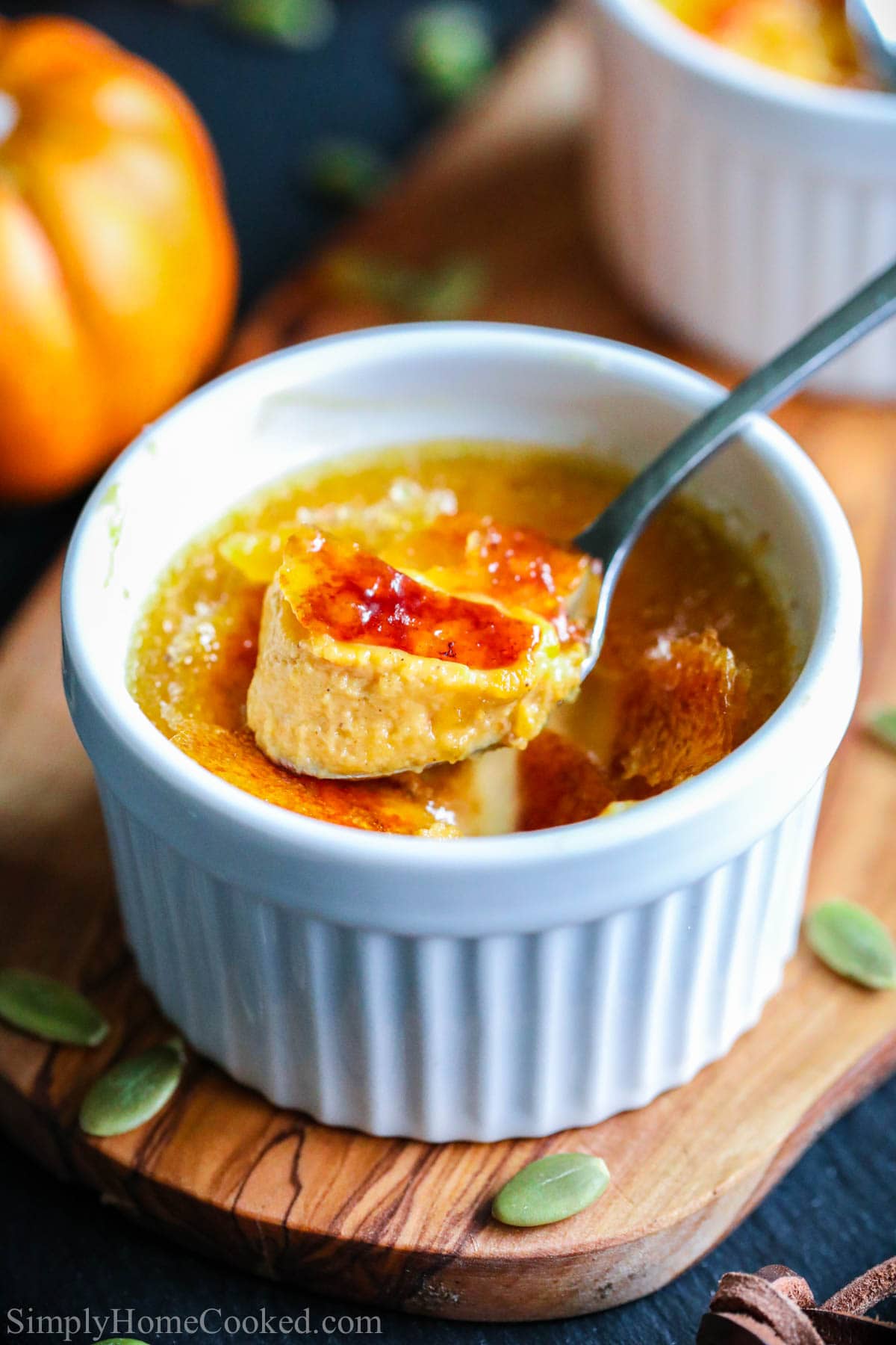 Pumpkin Creme Brulee: in a ramekin with a spoonful being lifted out 