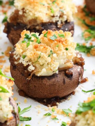 Closeup of Crab Stuffed Mushrooms covered in Panko breadcrumbs and parsley.