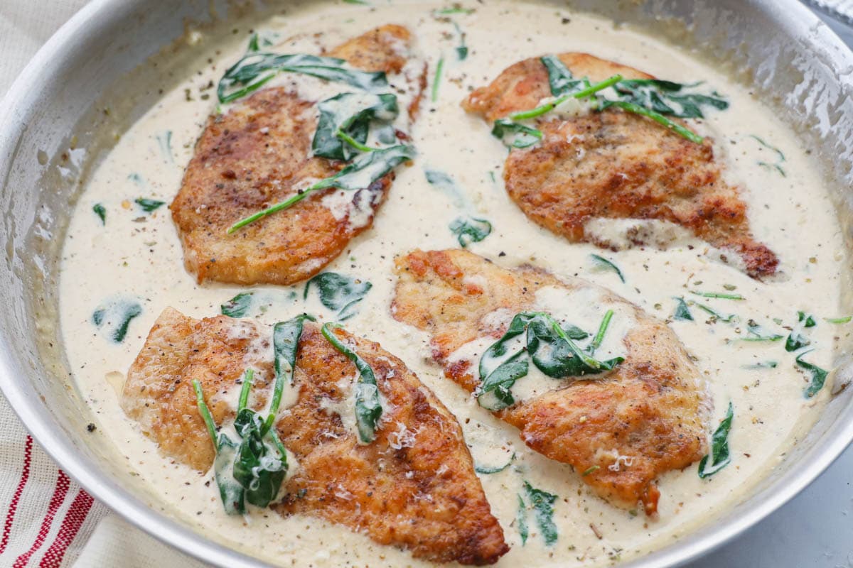 Chicken Florentine in a pan.