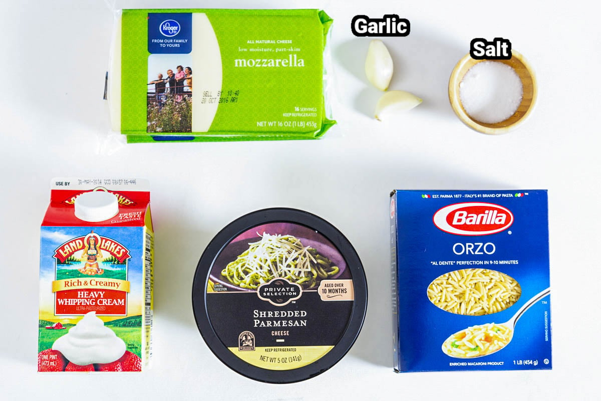 Ingredients in Creamy Orzo: mozzarella, Parmesan, orzo, heavy cream, salt, and garlic cloves.