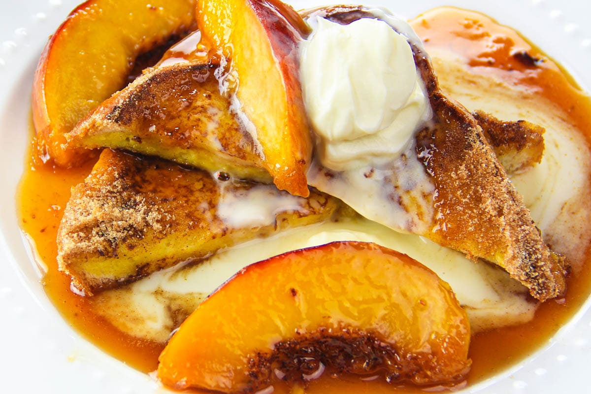 Peach french toast with peach syrup and topped with creme fraiche.