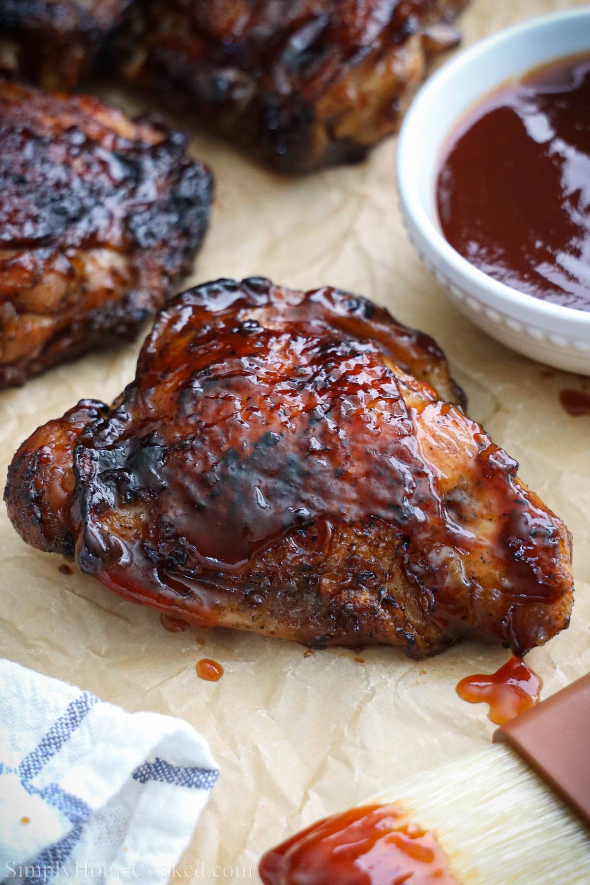 Grilled BBQ Chicken Thighs topped with bbq sauce.