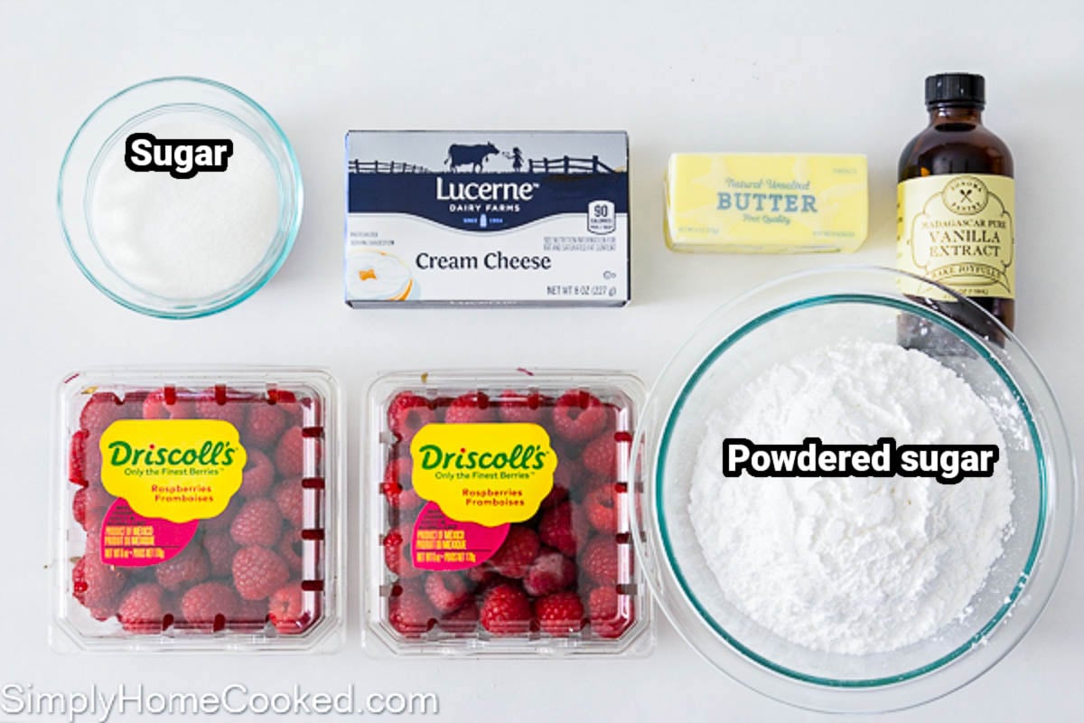 Ingredients for raspberry buttercream: cream cheese, sugar, raspberries, butter, vanilla and powdered sugar.