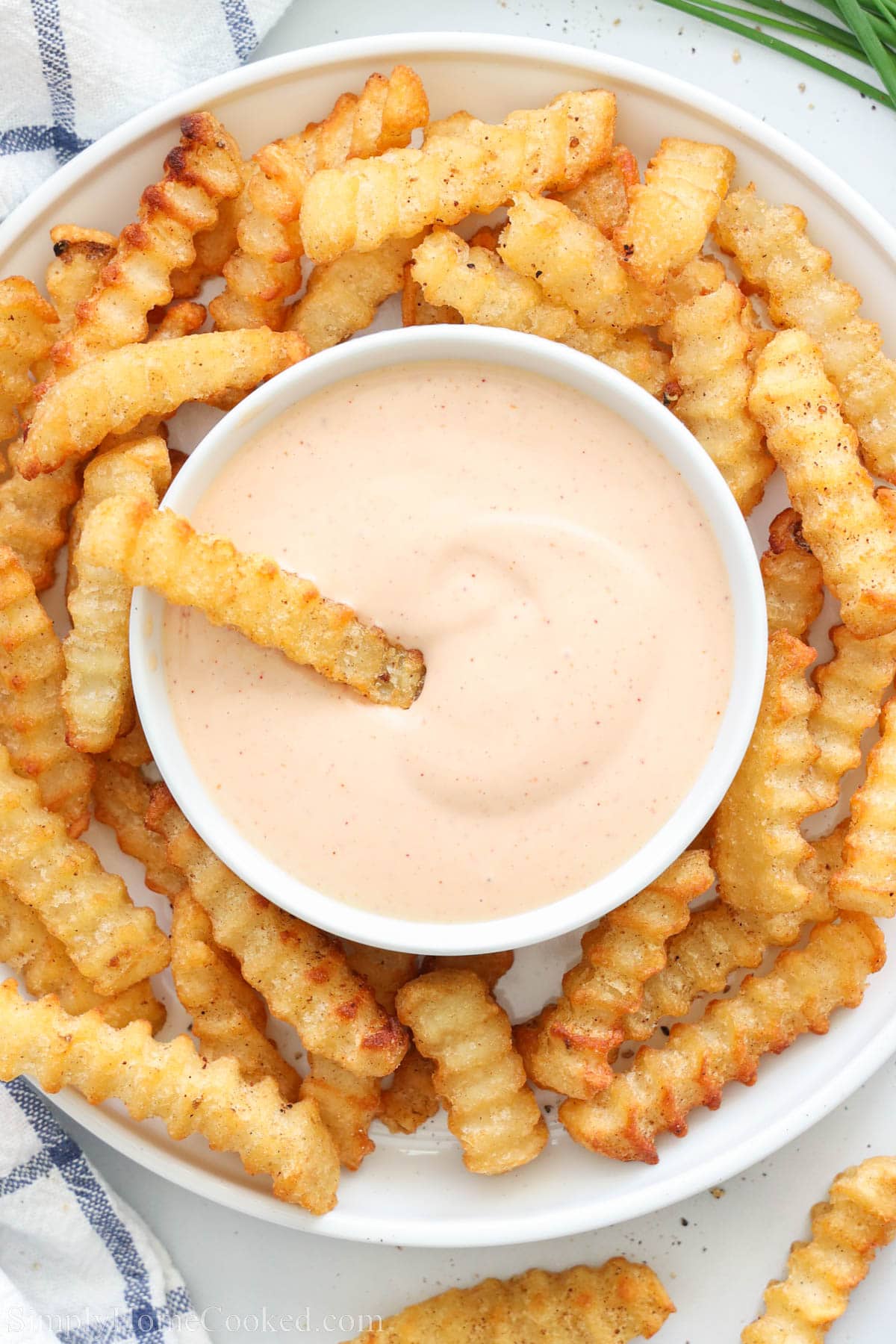 Overview of Fry Sauce surrounded by crinkle French fries.