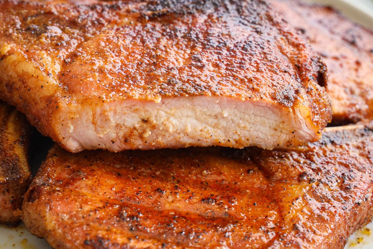 Slices of smoked pork chops piled high.