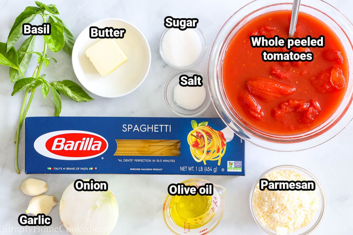 Ingredients for Pasta Pomodoro: basil, butter, sugar, salt, whole peeled tomatoes, spaghetti, olive oil, Parmesan, onion, and garlic.