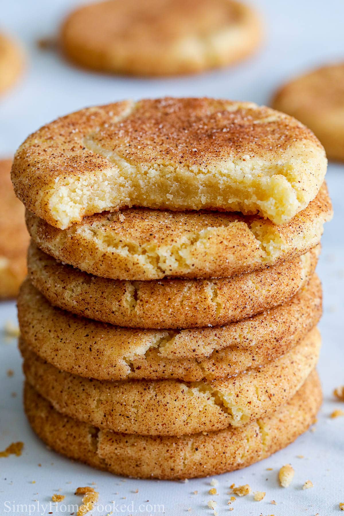 Stack of Snickerdoodle Cookies, the top one missing a bite. 