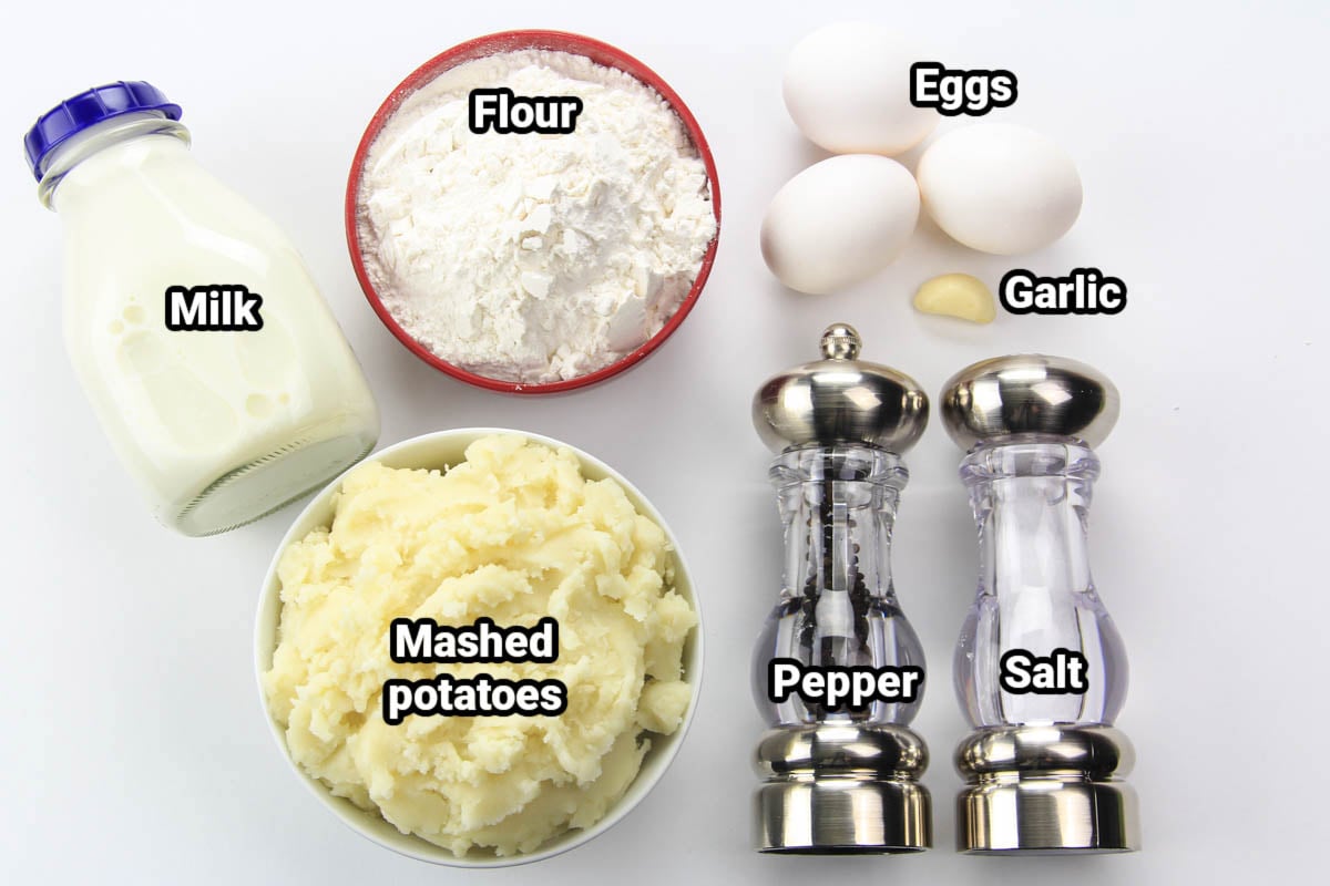 Ingredients for Mashed Potato Pancakes: mashed potatoes, flour, milk, eggs, garlic, salt, and pepper.