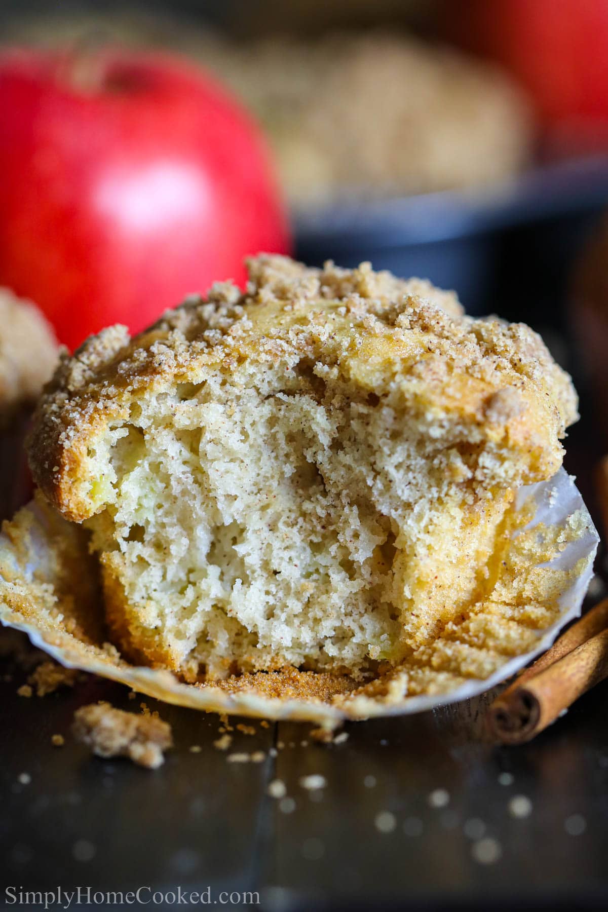 Close up of a Cinnamon Apple Muffin missing a bite.