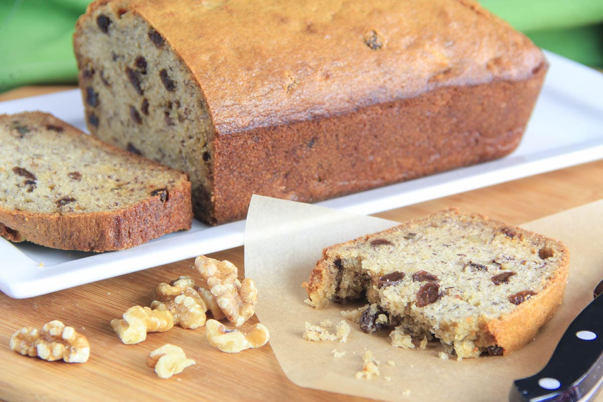 Banana Walnut Bread with a slice sitting nearby. 