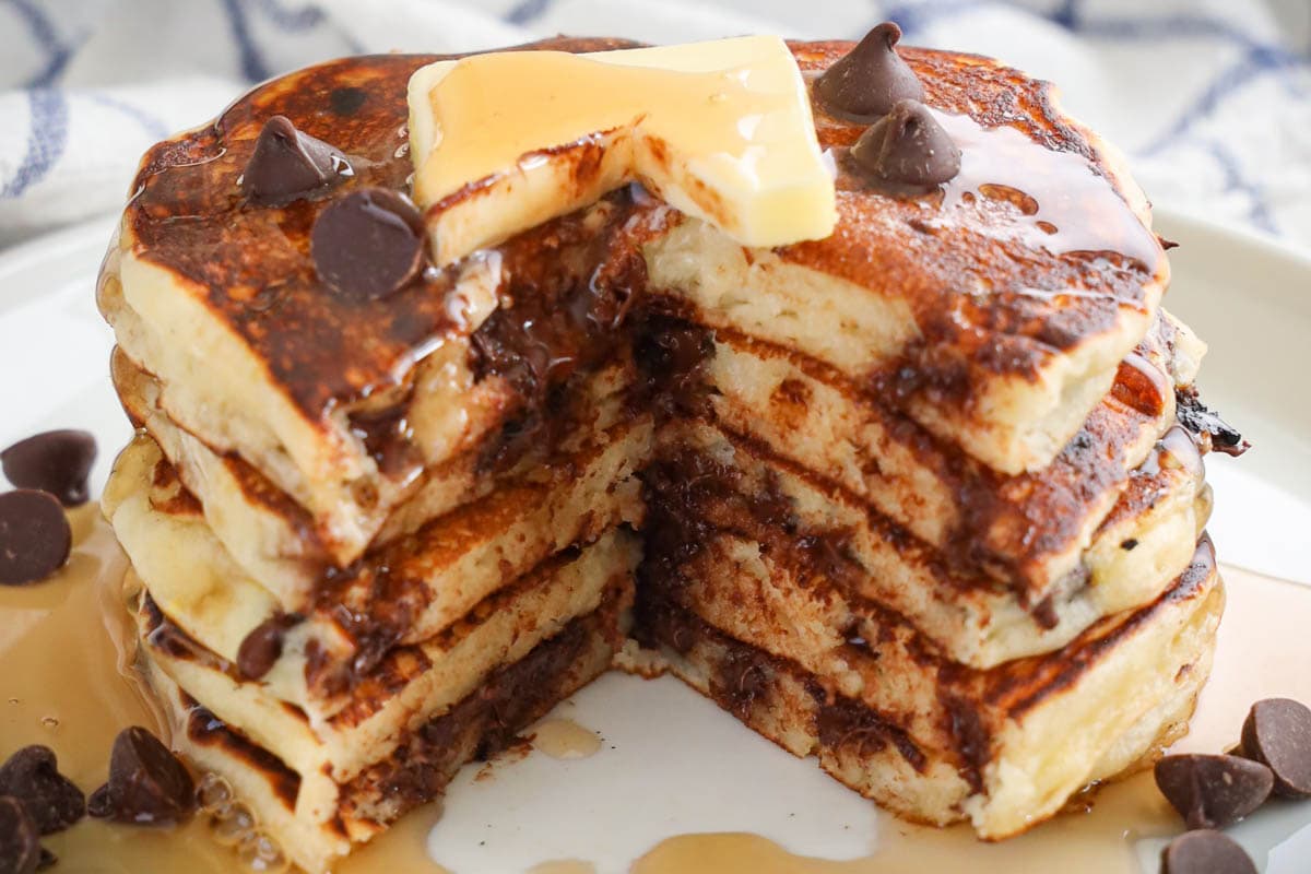 Stack of Chocolate Chip Pancakes missing a piece.