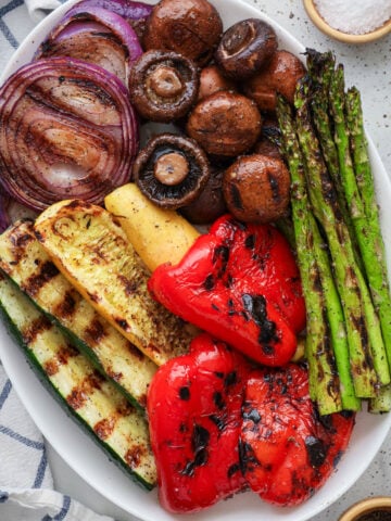 Grilled vegetables including zucchini, yellow squash, mushrooms, asparagus, red pepper, and red onion.