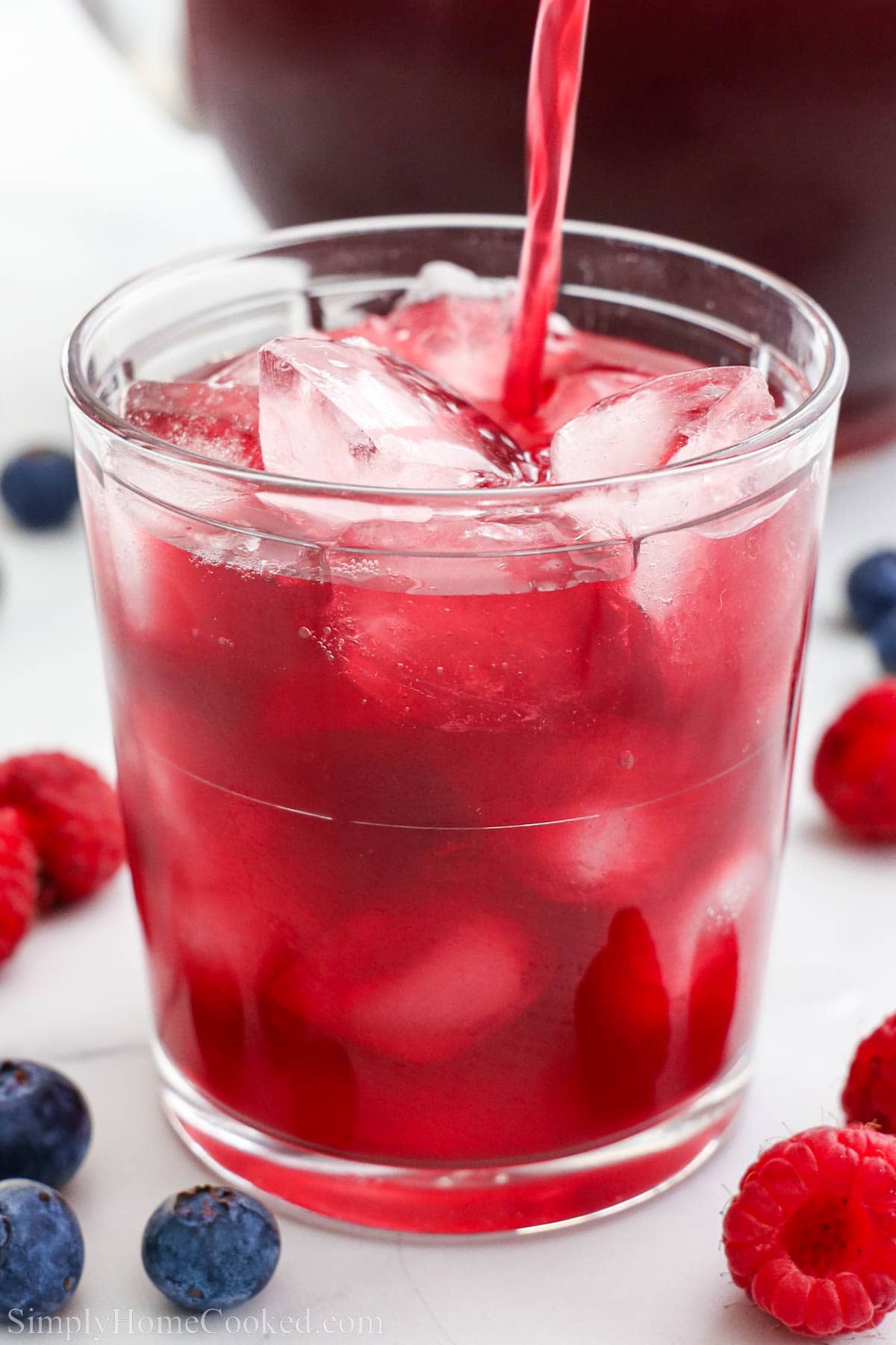 Kompot being poured into a glass.