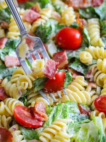 Close up of a fork in a BLT Pasta Salad.