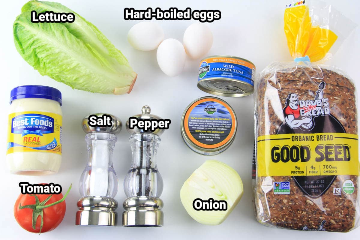 Ingredients for Tuna Salad Sandwich: bread, lettuce, tomato, hard boiled eggs, onion, tuna, mayonnaise, salt, and pepper.