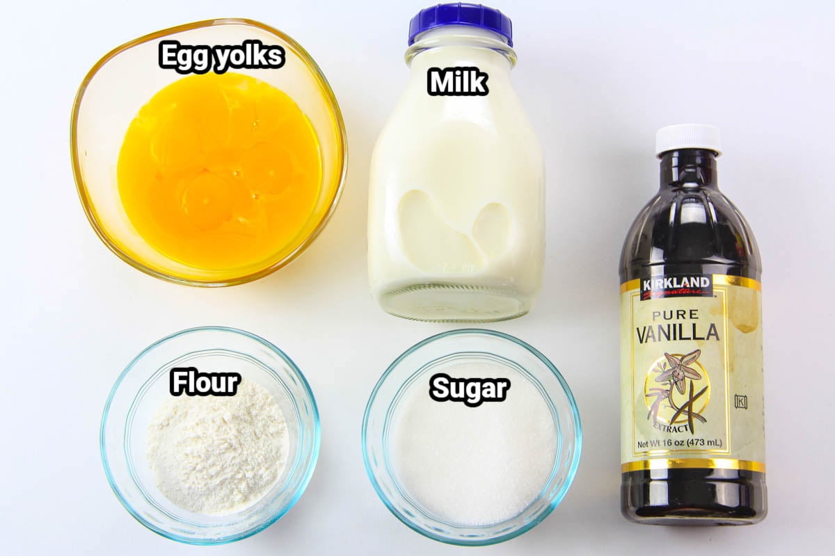 Ingredients for custard for Mini Fruit Tarts: egg yolks, milk, vanilla extract, flour, and sugar.