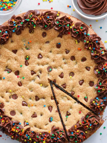 Cookie Cake with a slice cut out.
