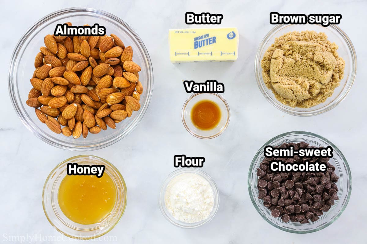 Ingredients for Lace Cookies with Chocolate: almonds, honey, butter, vanilla, flour, brown sugar, and semi-sweet chocolate chips. 