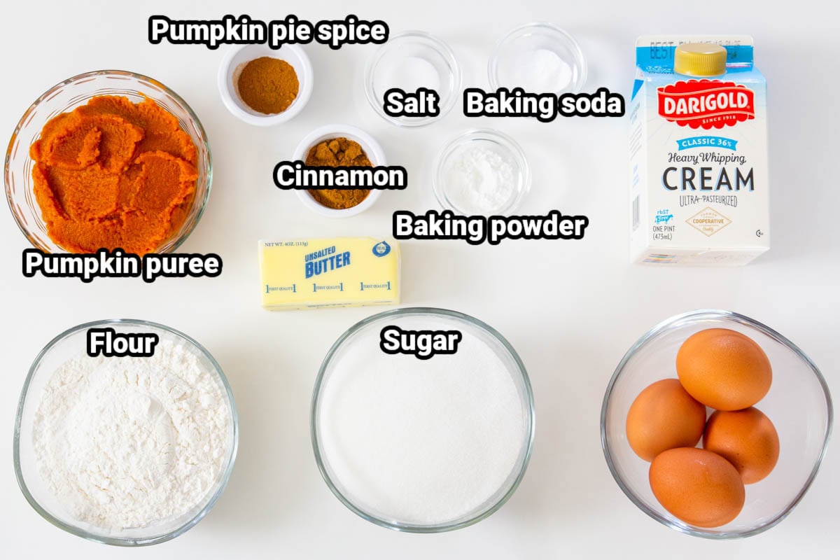 Ingredients for Pumpkin Spice Cupcakes: pumpkin puree, pumpkin pie spice, cinnamon, salt, baking powder, baking soda, heavy cream, flour, sugar, butter, and eggs. 