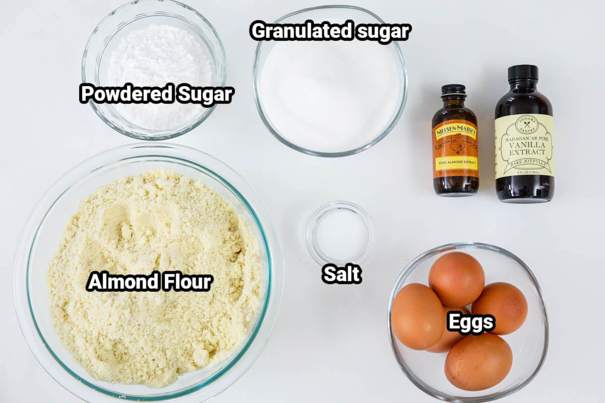 Ingredients for Amaretti Cookies: almond flour, powdered sugar, granulated sugar, salt, eggs, vanilla extract, and almond extract.