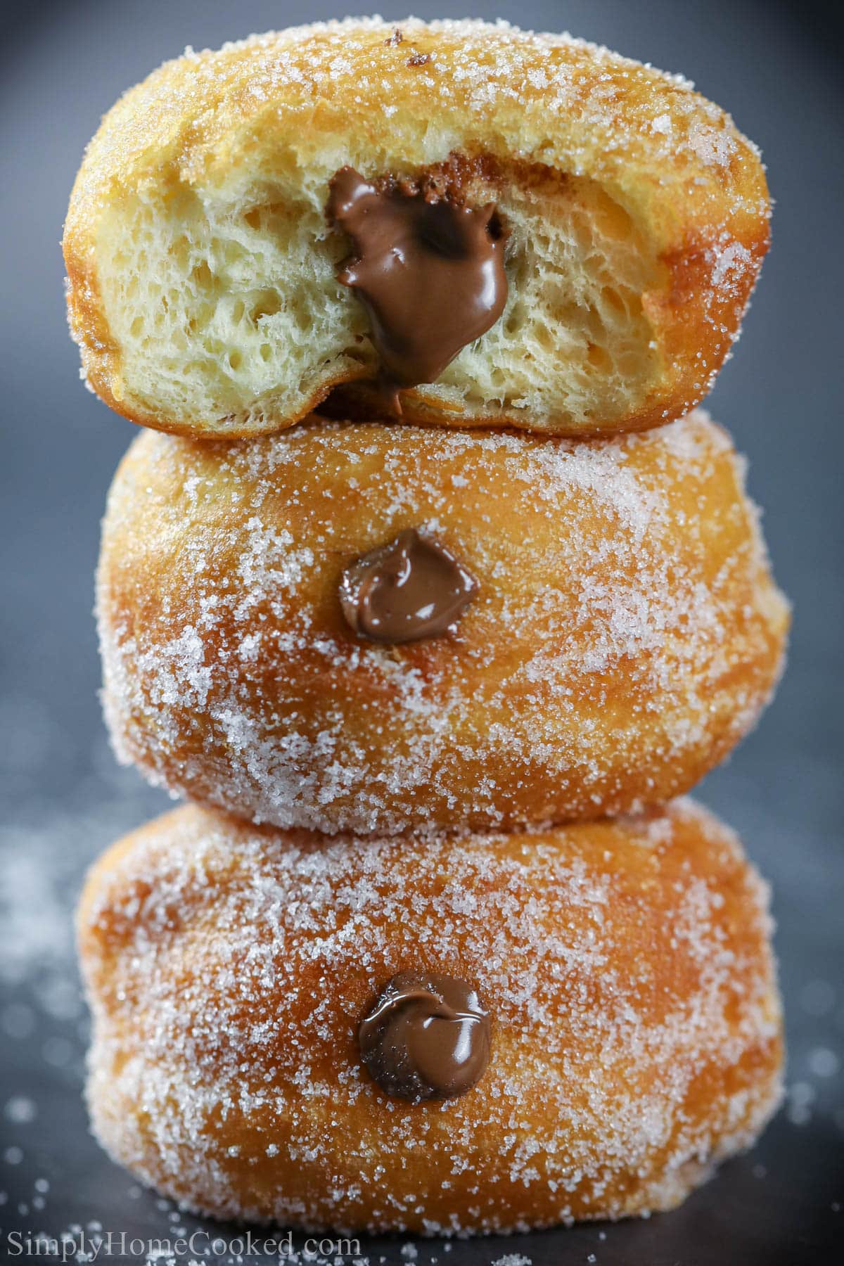 Stack of Brioche Donuts with chocolate custard filling. 