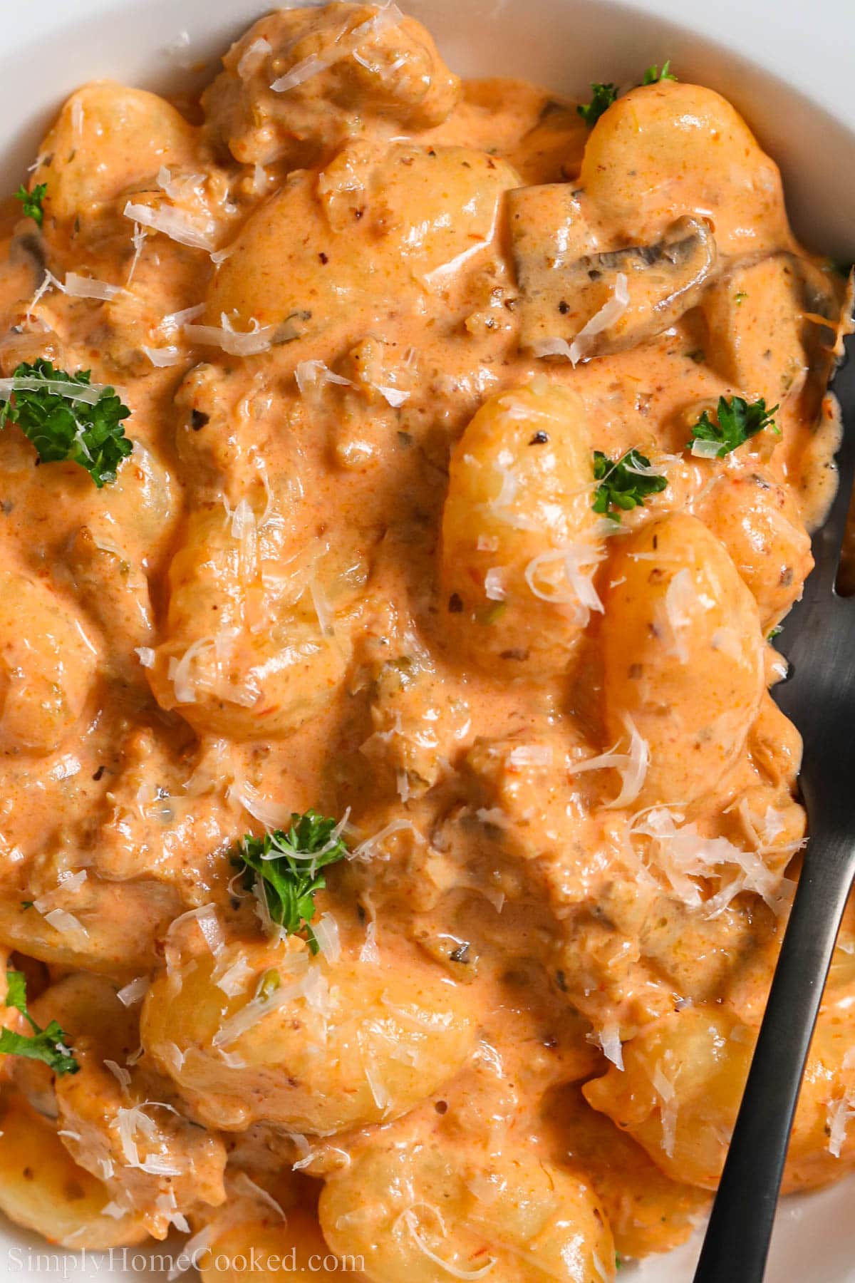 Close-up of creamy sausage gnocchi.