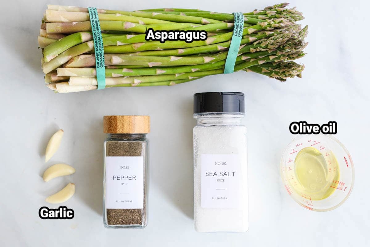 Ingredients for Oven Roasted Asparagus: asparagus, garlic cloves, pepper, sea salt, and olive oil.