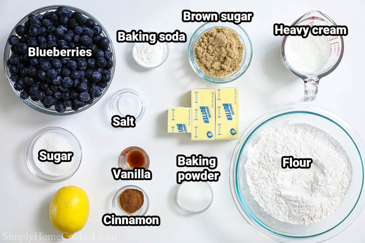 Ingredients for Blueberry Muffins: blueberries, baking soda, baking powder, brown sugar, heavy cream, butter, salt, vanilla, sugar, cinnamon, lemon, and flour.