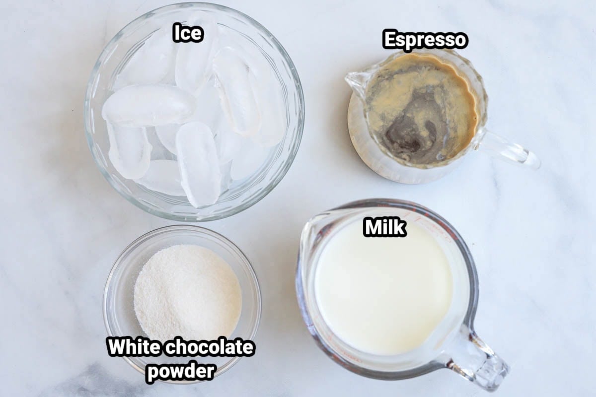 Ingredients for Iced White Chocolate Mocha: ice, espresso, white chocolate powder, and milk.