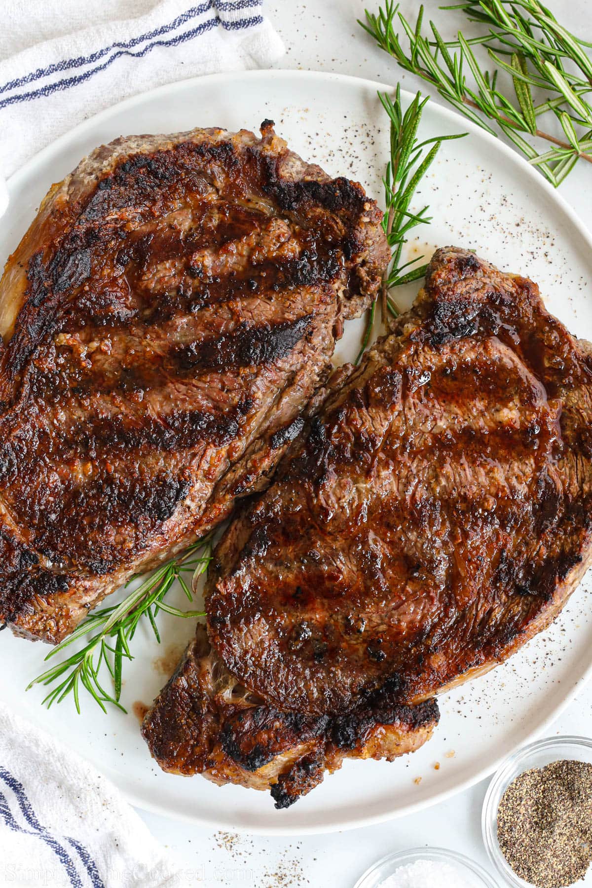 Grilled Ribeye Steak with a rosemary sprig.