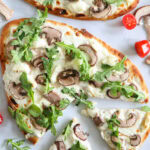 Mushroom Arugula Flatbread Pizza sliced.