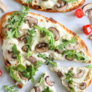 Mushroom Arugula Flatbread Pizza sliced.